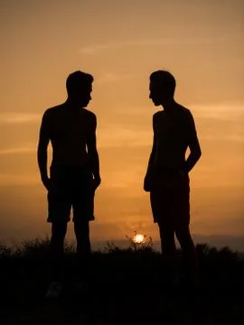 Two young friends walking Stock Photos