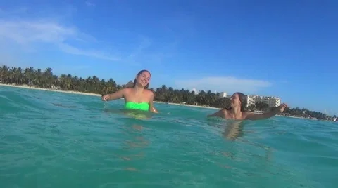 Two young girls playing in the sea 스톡 동영상 41830153