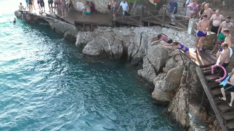 Two Young Girls Synchronized Diving into Sea - Akyaka Turkey 16 Aug 2023 Stock Footage 329378480