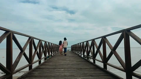 Two young girls walking on the bridge Stock Footage 218427130