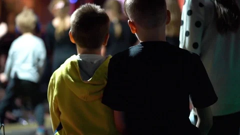 Two young guys dancing at a concert, view from behind Stock Footage 111729064