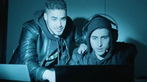 Two young guys experiencing difficulties while hacking Stock Footage 181820651