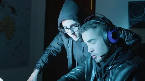 Two young guys talking and discussing things while hacking Stock Footage 181791144