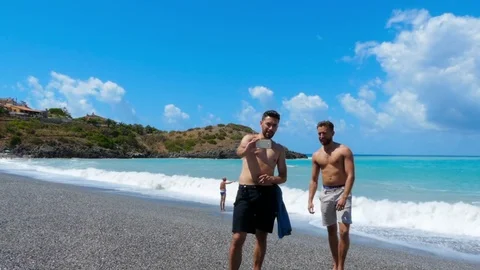 Two young handsome men taking selfie photo on their smartphones. Stock Footage 83930579