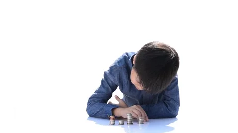 Two Young happy Thai boy build a tower by a coin 库存影片 68810845
