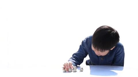 Two Young happy Thai boy build a tower by a coin 库存影片 68810858