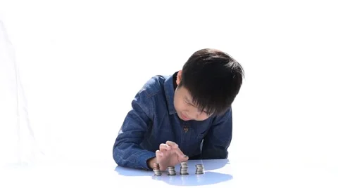 Two Young happy Thai boy build a tower by a coin 库存影片 68810900
