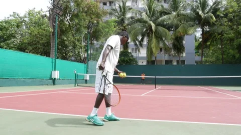 Two YOUNG INDIAN Men PLAYING TENNIS  Stock Footage 94228195