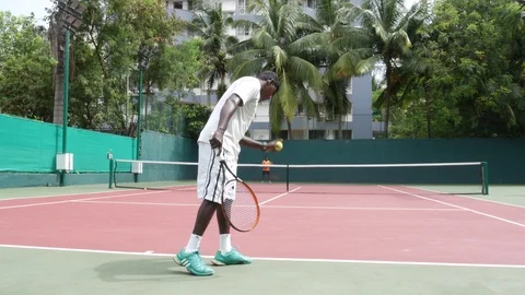 Two YOUNG INDIAN Men PLAYING  a tennis match  Stock Footage 94228581