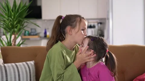 Two Young Kids Sisters Have Fun, Hugging... | Stock Video | Pond5