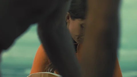 Two young lifeguards performing CPR on the beach Stock Footage 263909845