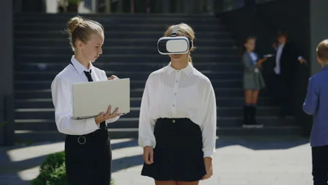 Two Young Little Office Workers Working Outside Using Virtual Reality Headset Stock Footage 236977200