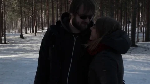 Two young lovers kiss during the walk. Scene of pleasure and enjoy Video stock 76555345