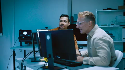 Two young male IT software developers high five celebrating successful codi.. Stock Footage 337084202