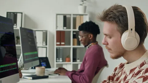 Two Young Male Programmers Coding on Computers in IT Office Stock Footage 330125092