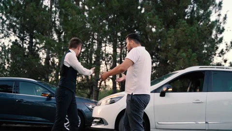 Two Young Man Arguing With Each Other After Car Accident On Street At Outdoor Video stock 138948171