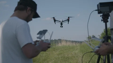 Two young man flying a remote control drone 스톡 동영상 94604286