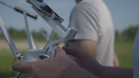 Two young man operate remote control drone 库存影片 94604289