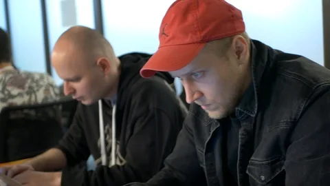 Two Young Man Working Hard At The Laptop Computer In The Office Stock Footage 120570347