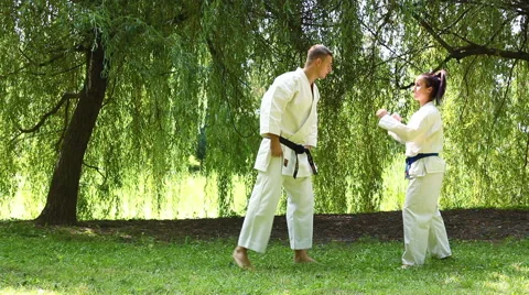 Two young Martial Arts fighters practicing in nature Stock-Footage 44348847