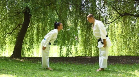 Two young Martial Arts fighters practicing in nature Stock Footage 44349962