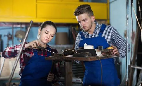 Two young masters are working together Stock-Fotos