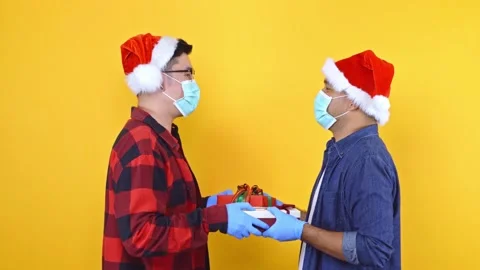 Two young men are friends, they celebrate New Year and Christmas and give each o Stock Footage 145131646