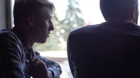 Two young men in a cafe discussing a project Stock-Footage 85224405