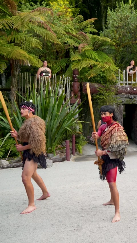 Two young men dancing traditional Maori Haka in Rotorua Stockbeeldmateriaal 331189370