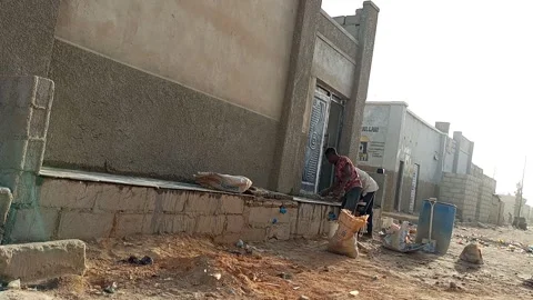 Two Young Men Decorating Floor With Tiles Ungogo Kano Nigeria 動画素材 329679956