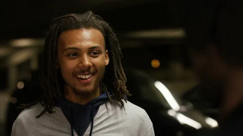 Two young men engaging in a friendly conversation - version 2 Stock Footage 66446809