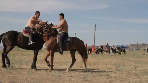 Two young men fighting on horseback Video stock 63216073