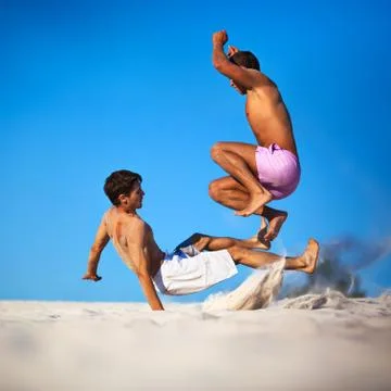 Two young men fighting Stock Photos