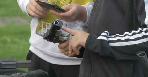 Two Young Men Hold in His Hands a Guns Stock Footage 62793385