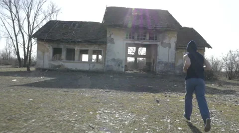 Two young men jogging in an abandoned place Video stock 60703021