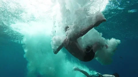 Two Young Men Jumping Into Deep Blue Sea Water Ocean Tropical Location Freedom Stock Footage 46198191