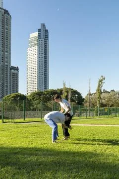 Two young men practicing a Jiu Jitsu leg grab technique Stock Photos