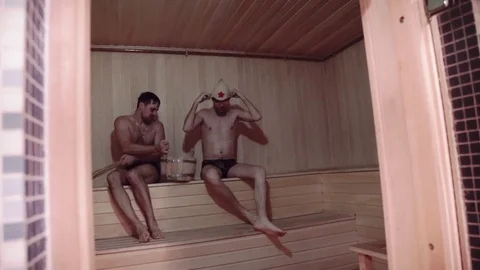 Two Young men relaxing in sauna Stock Footage 73529065