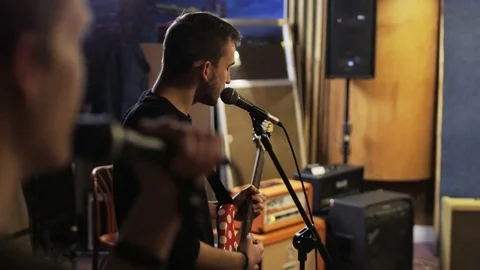 Two Young Men Singing, One of Them is Playing a Guitar Stock Footage 72202980
