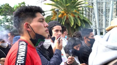 Two young men smokes a joint of weed Stock Footage 139474703
