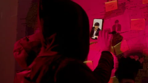 Two young men standing in front of wall map with strings Stock Footage 181795471