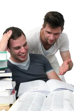 Two young men studying together Stock Photos