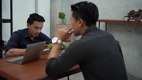 Two young men take a break with bread Stock Footage 101865008