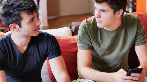 Two young men talking and chatting Stock Photos