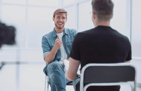 Two young men talking in the TV Studio Stock Photos