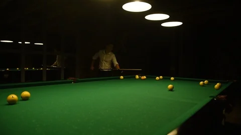 Two young men in white shirts play billiards. Stock Footage 120111467