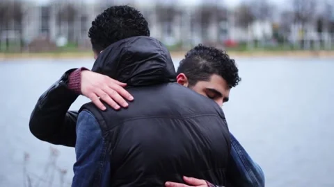 Two young middle eastern men hugging eac... | Stock Video | Pond5