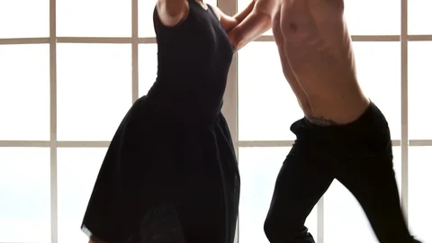Two young modern ballet dancers dancing indoor. Stock Footage 107951077