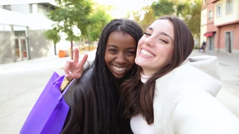 Two young multicultural friends taking selfie and having fun together - Stock Footage 240626698