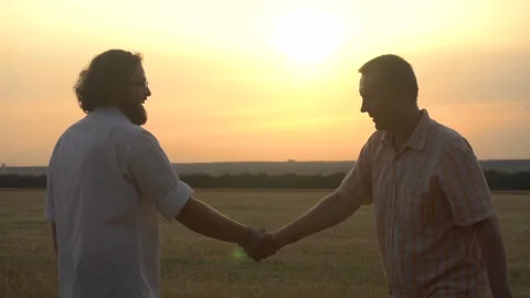 Two young people are happy to meet, shake hands. Successful business concept Stock Footage 169012953